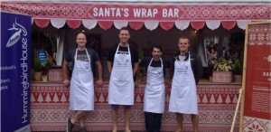 The Wood & Grieve Engineers Brisbane team helps wrap presents for the Hummingbird House fundraiser.